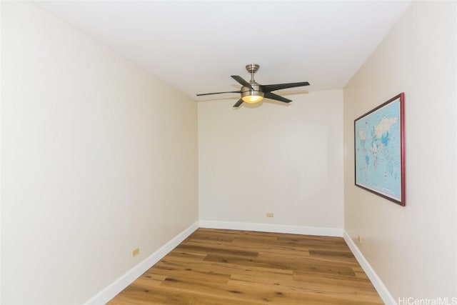 spare room featuring hardwood / wood-style floors and ceiling fan