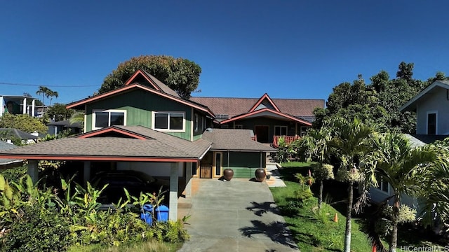 view of front of home with a shingled roof