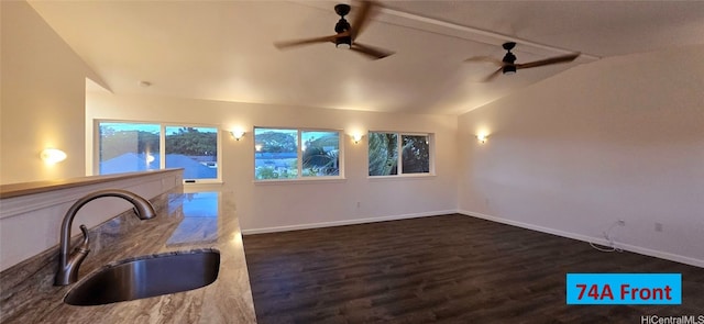 interior space featuring dark hardwood / wood-style floors, lofted ceiling, sink, and ceiling fan