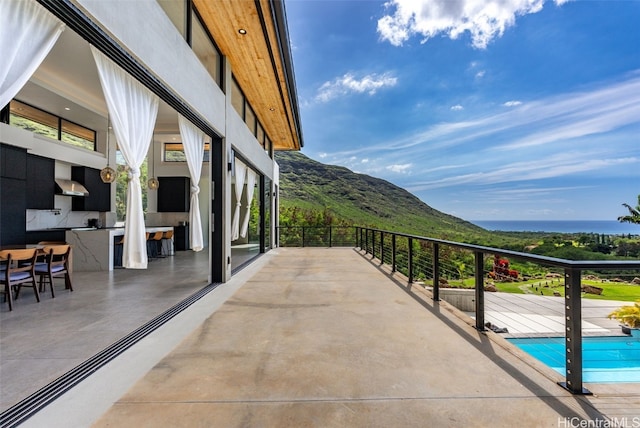 balcony with area for grilling and a mountain view