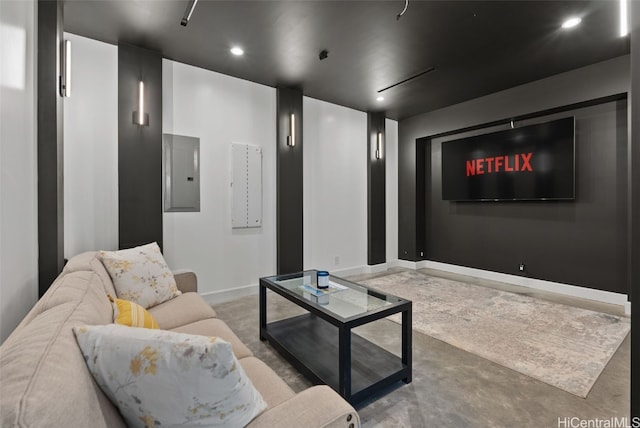 cinema with electric panel, baseboards, finished concrete flooring, and recessed lighting