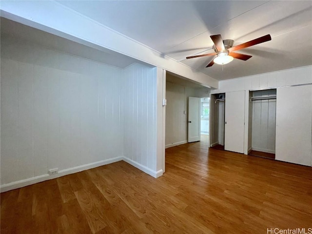 unfurnished bedroom featuring ceiling fan and hardwood / wood-style floors