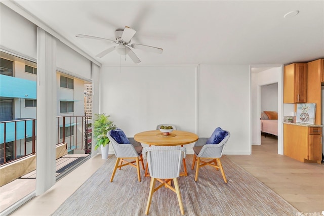 222 Kaiulani Ave Unit Ph4, Honolulu, HI 96815 - dining space with a ceiling fan and light wood-style flooring