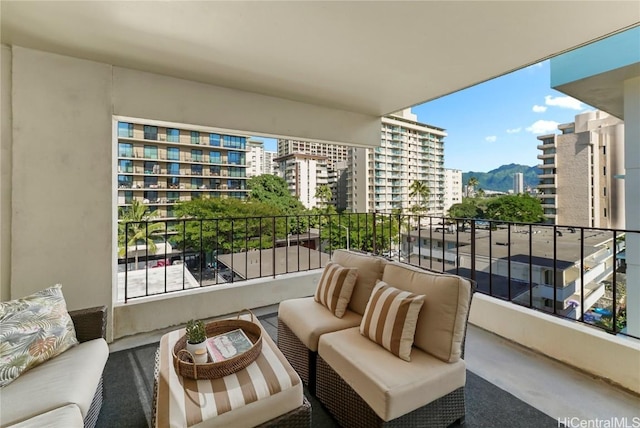 balcony with outdoor lounge area and a mountain view