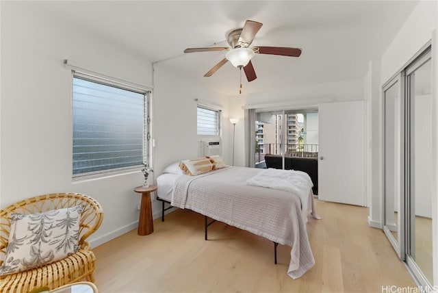 bedroom featuring ceiling fan and light wood-type flooring