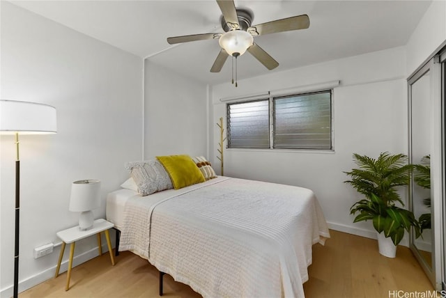 bedroom featuring ceiling fan and light wood-type flooring