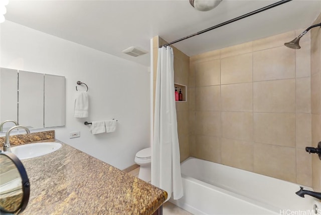 full bathroom featuring shower / bathtub combination with curtain, vanity, and toilet