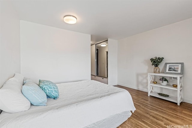 bedroom with wood-type flooring