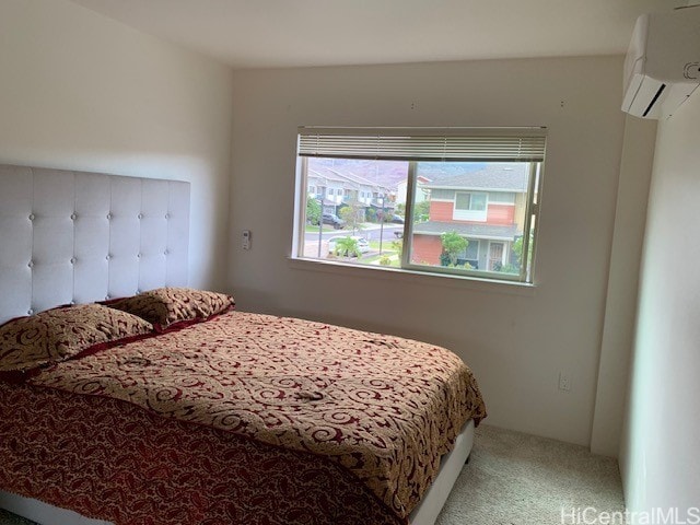 carpeted bedroom with a wall mounted AC