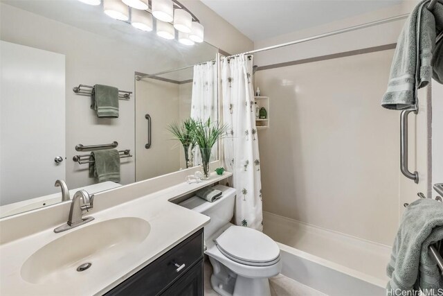 bathroom with vanity, toilet, and a shower with shower curtain