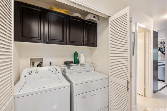 laundry area featuring cabinets and washer and dryer