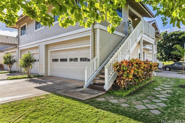 view of home's exterior featuring a balcony and a garage