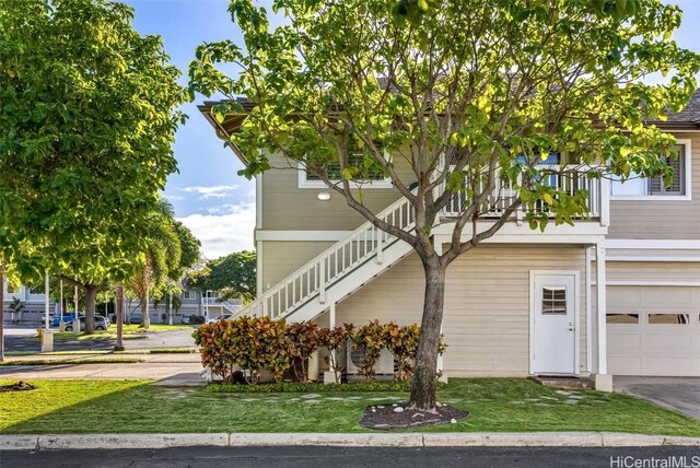 view of front of house with a balcony and a garage