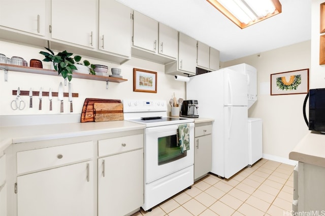 kitchen featuring white cabinetry, white appliances, and light tile patterned flooring