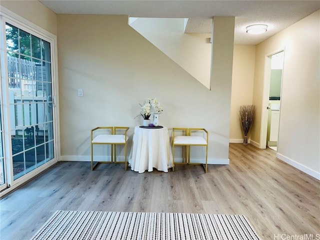 unfurnished room with light wood-type flooring