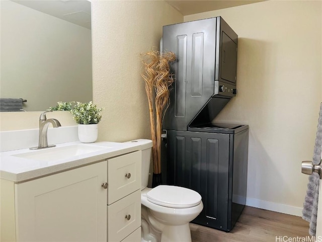 bathroom with vanity, toilet, and hardwood / wood-style floors