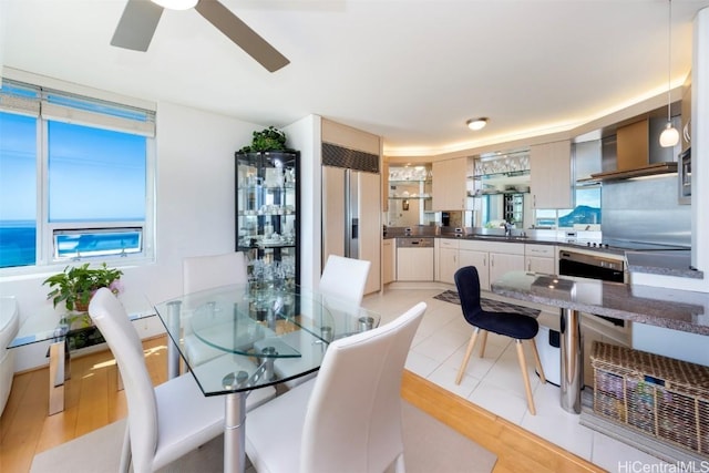 dining room with sink and ceiling fan