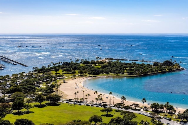 aerial view with a water view and a beach view