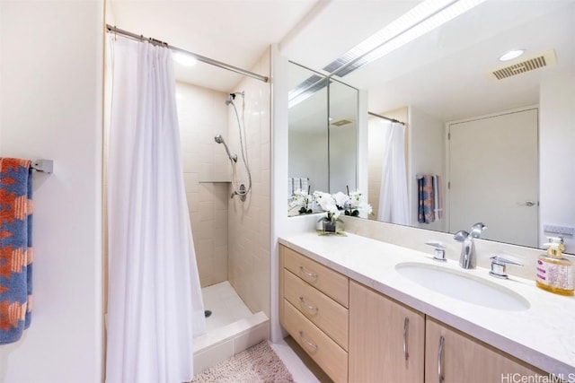 bathroom featuring vanity and a shower with curtain