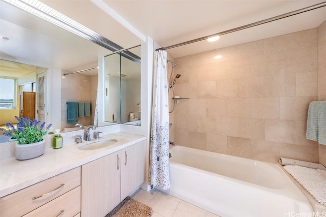 bathroom with tile patterned flooring, vanity, and shower / tub combo with curtain