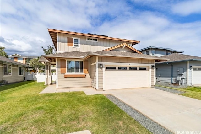 view of front of house featuring a garage and a front lawn