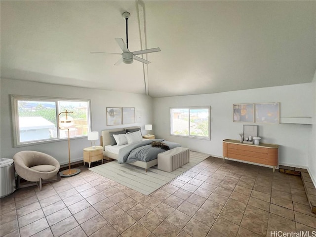 tiled bedroom with ceiling fan and lofted ceiling