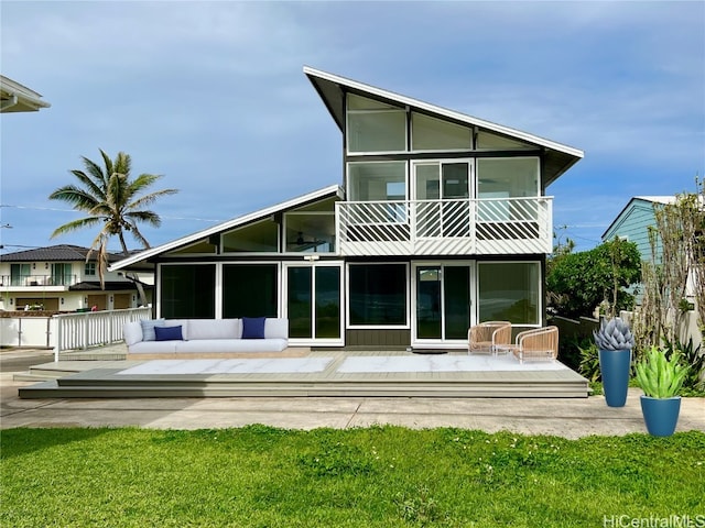 back of house featuring an outdoor hangout area