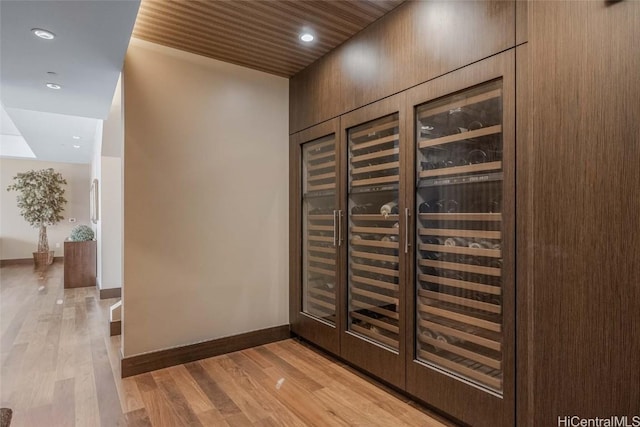 wine room with light hardwood / wood-style flooring