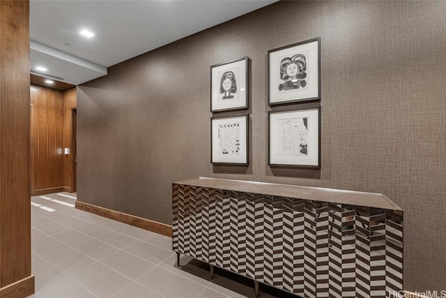 hall featuring light tile patterned flooring