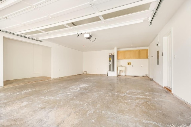 garage with a garage door opener, sink, electric panel, and electric water heater