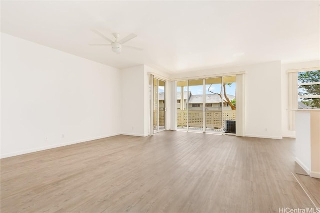 unfurnished living room featuring light hardwood / wood-style floors and ceiling fan