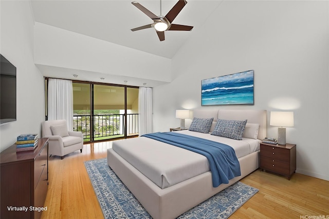 500 Lunalilo Home Rd Unit 28G, Honolulu, HI 96825 - bedroom with light wood-style floors, high vaulted ceiling, access to outside, and baseboards