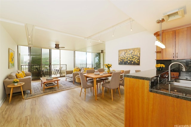 500 Lunalilo Home Rd Unit 28G, Honolulu, HI 96825 - dining room featuring light wood-style floors, rail lighting, and ceiling fan