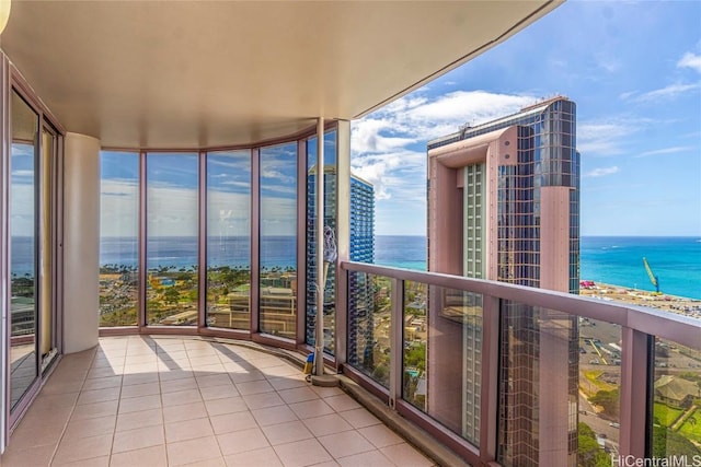 balcony featuring a water view