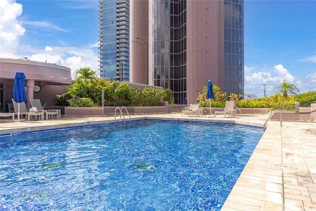 view of swimming pool with a patio area