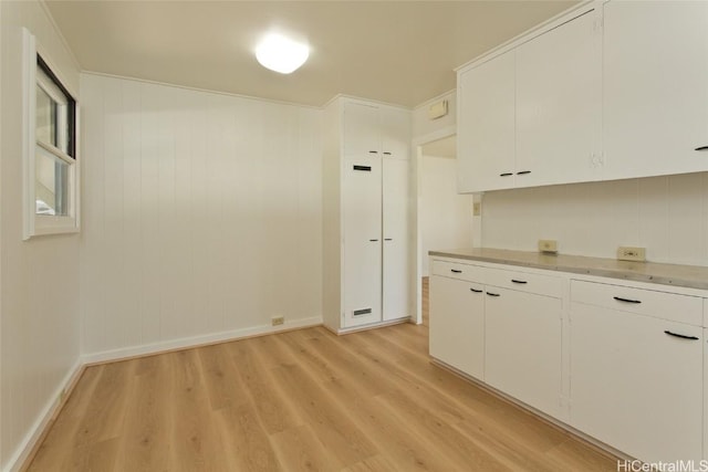 interior space featuring white cabinets and light wood-type flooring