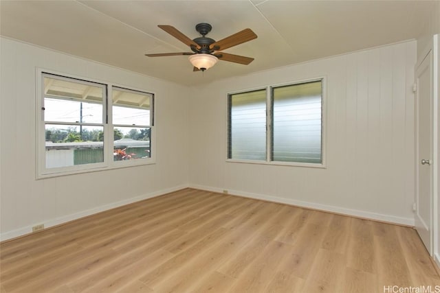 spare room featuring ceiling fan and light wood-type flooring