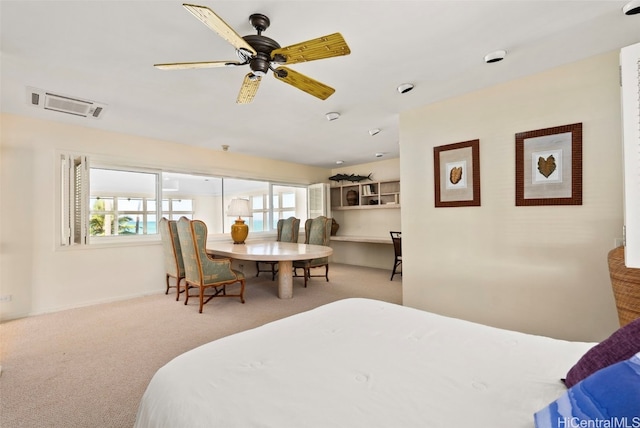 bedroom featuring light colored carpet