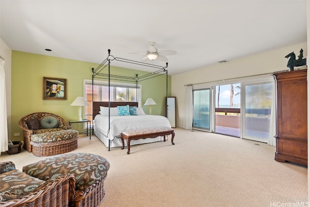 bedroom with light carpet, access to outside, and ceiling fan