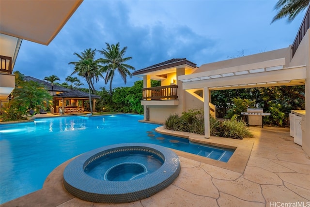 view of swimming pool featuring an in ground hot tub, area for grilling, a patio area, and a gazebo