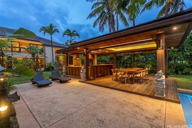 view of patio terrace at dusk