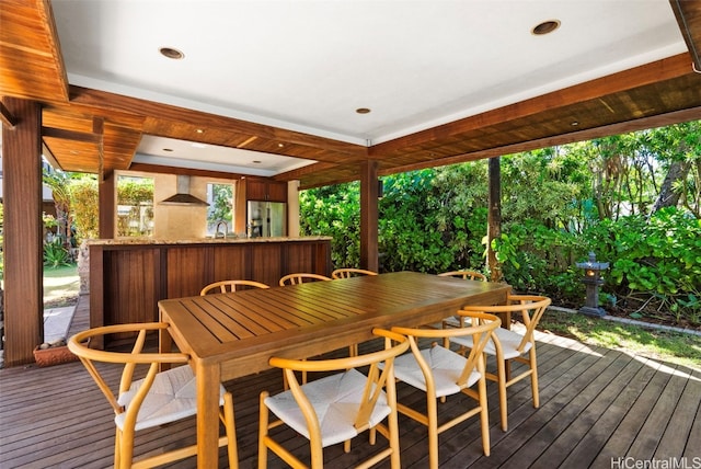 wooden terrace with an outdoor wet bar