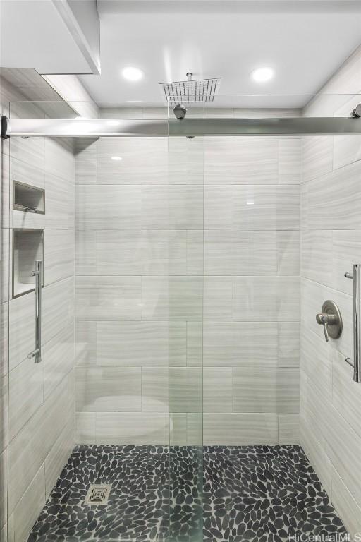 bathroom with a shower with shower door