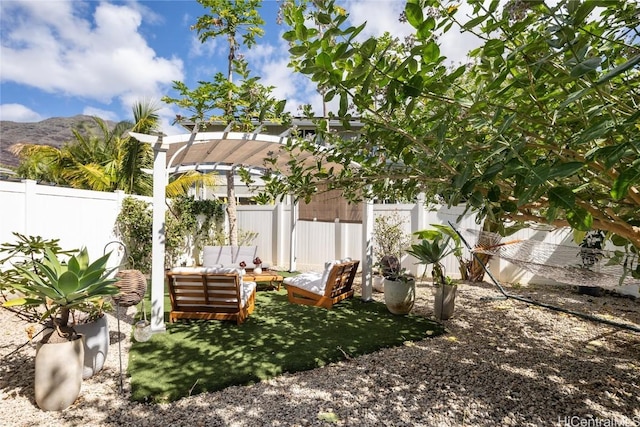 view of yard with a mountain view, a pergola, and outdoor lounge area