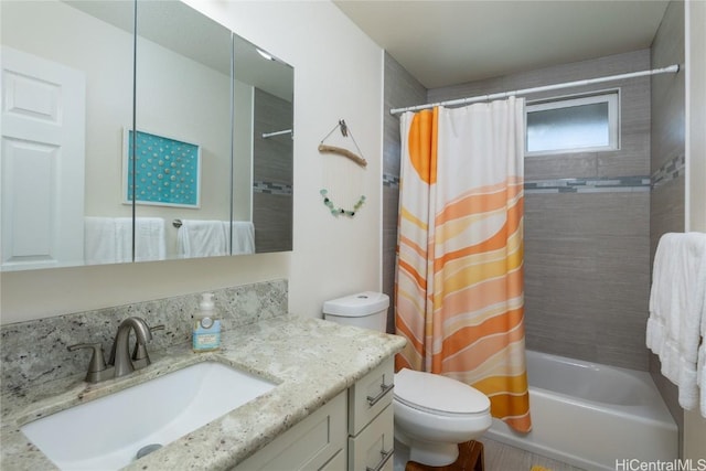 full bathroom with shower / bath combo, vanity, and toilet