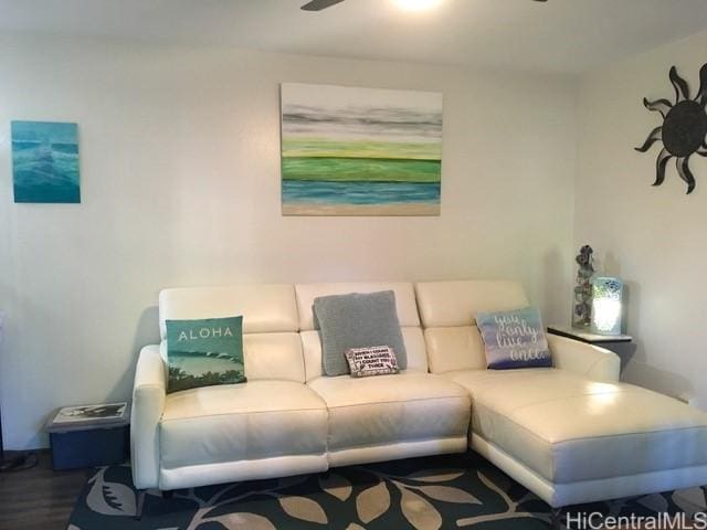 living room featuring ceiling fan and wood finished floors