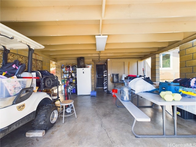 garage with white fridge