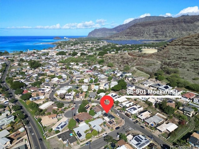 aerial view featuring a water and mountain view