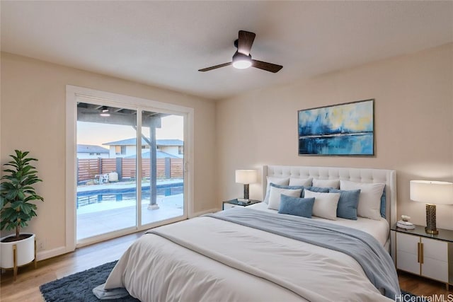 bedroom featuring wood-type flooring, access to exterior, and ceiling fan