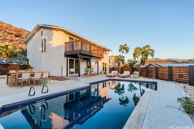 view of pool featuring a patio and a mountain view